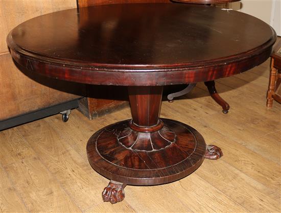 A Victorian circular mahogany centre table on platform base with claw feet, 117cm
